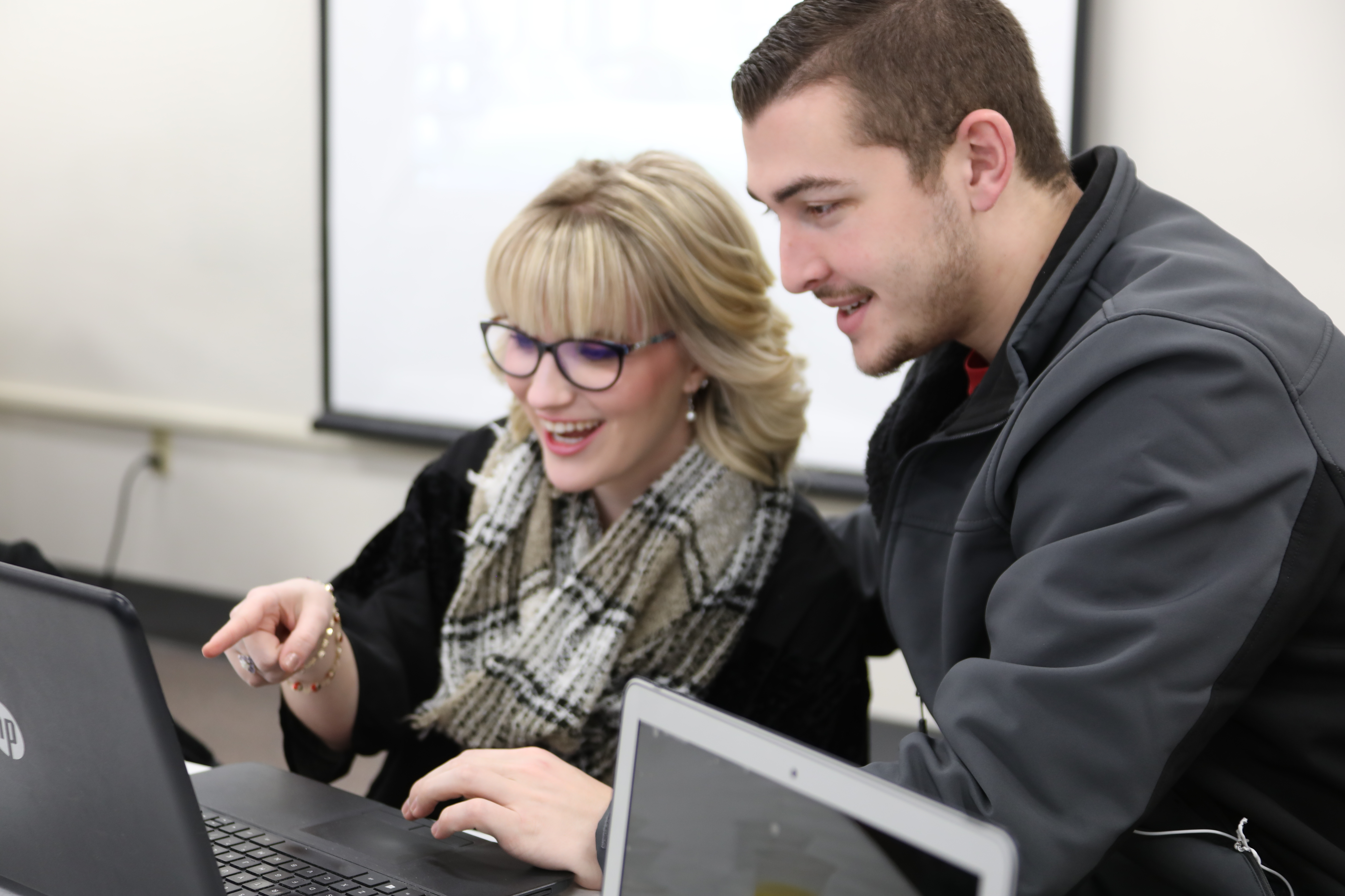 Students looking at computer